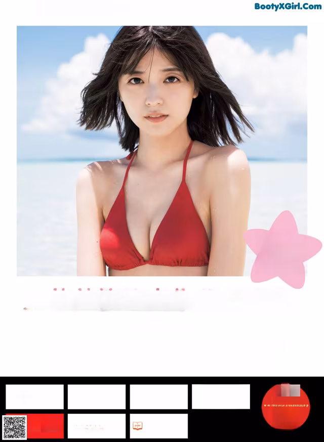 A woman in a red bikini standing on a beach.